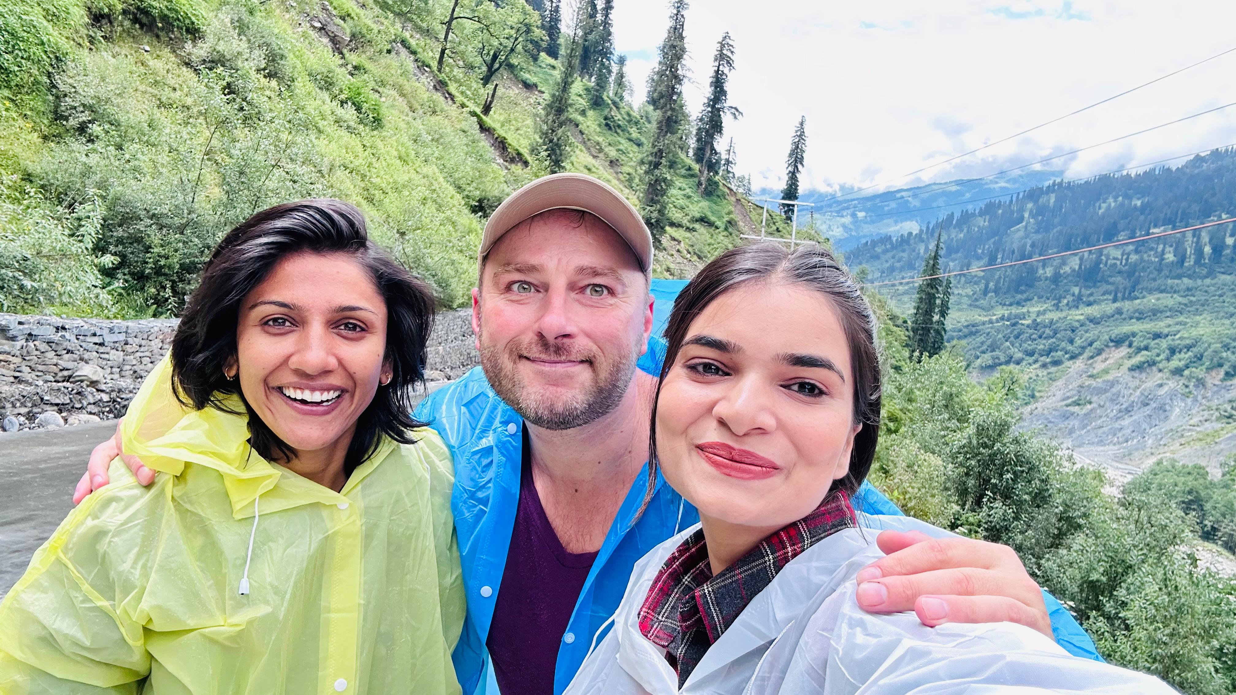 Suneha laughing on a Himalayan mountain trail with international traveler